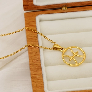 Golden stainless steel Pisces zodiac pendant necklace displayed in a premium wooden box