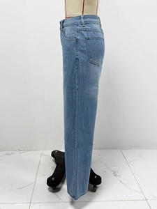 Side view of light blue straight-leg denim jeans on mannequin with clear stitching