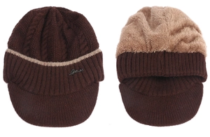 Detailed knit texture and warm faux fleece lining of the winter peaked cable beanie