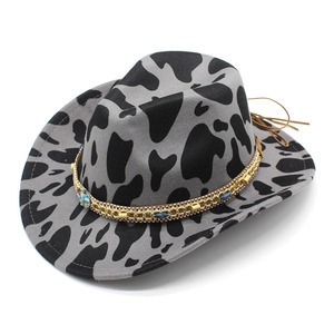 Detail of grey wool cowboy hat with cow print, gold chain and turquoise gemstone band
