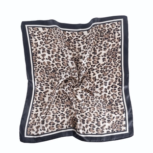 Leopard print square satin silk scarf with black and white borders on white background