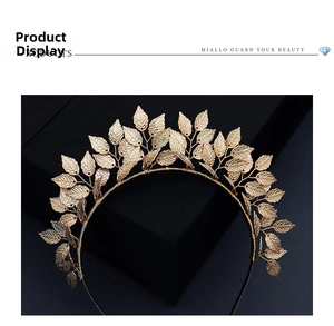 Detailed macro view of golden leaf texture and metal craftsmanship on a bridal tiara