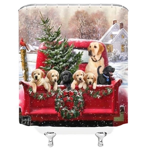 Detail of Christmas shower curtain with red truck, golden retriever puppies, and snow scene