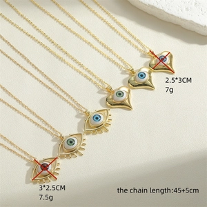 Gold Evil Eye heart pendant necklace with blue enamel and textured chain jewelry