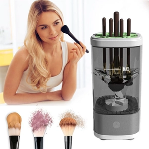 Detail of automatic electric makeup brush cleaner showing max water line and brush heads