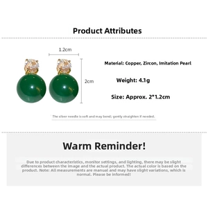 Detailed view of emerald faux pearl earrings showing dimensions 2cm by 1.2cm
