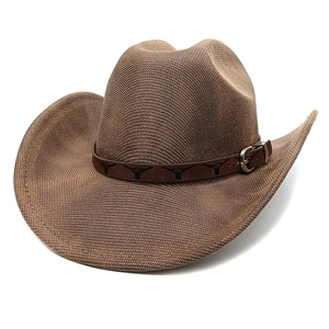 Detail of brown woven cowboy hat featuring a leather strap with bull head prints
