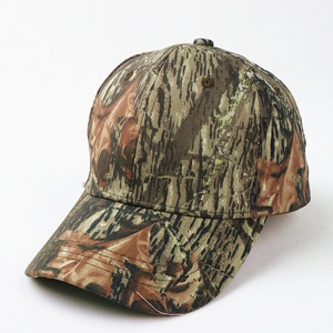 Detailed close-up of woodland camouflage cotton fabric and stitching on a baseball cap