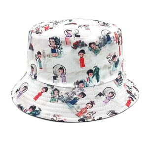 Detailed close-up of cartoon character prints on a white bucket sun hat for outdoor wear