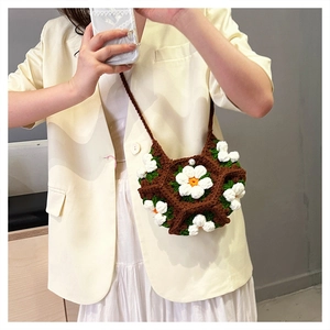 Handmade brown crochet shoulder bag with 3D white daisy flowers and knit strap