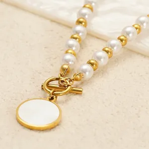 Elegant pearl necklace with golden beads, T-bar toggle clasp and circular charm pendant