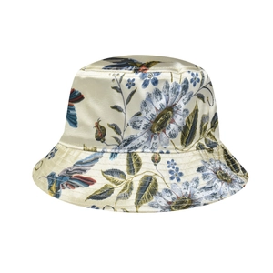 Detailed close-up of glossy floral and bird print on women's beige satin bucket hat