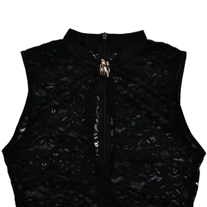 Detailed view of black lace sleeveless top featuring a gold buckle and front chest zipper
