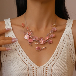 Bohemian multi-layer necklace with pink irregular shell beads and metallic round beads