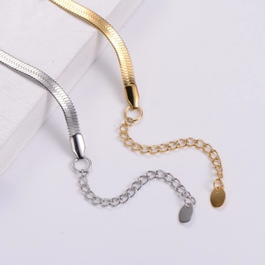 Elegant 18k gold and silver plated flat snake chain bracelets with zircon on white stone
