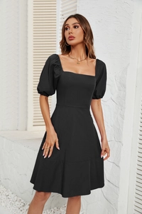 Detail of square neckline and puff sleeves on this elegant black summer dress