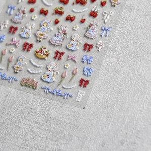 3D embossed nail stickers featuring vintage girls, strawberries, and lace bow designs