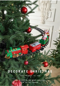 Close-up of electric Christmas train carriages running on a suspended tree track