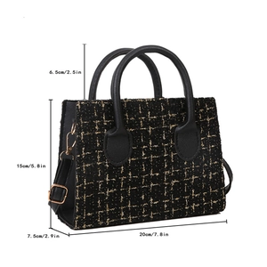 Black plaid tweed handbag with dimensions 20cm x 15cm x 7.5cm and gold hardware detail