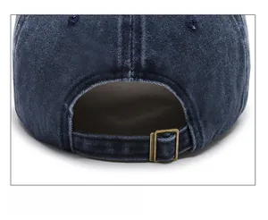 Detail of vintage washed navy baseball cap with adjustable metal buckle strap at back