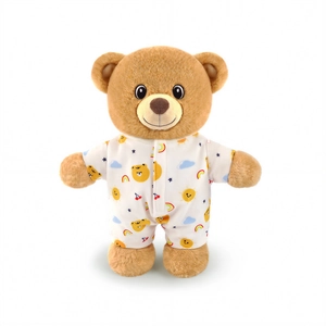 Cute brown plush teddy bear wearing white pajama with colorful cartoon animal patterns
