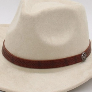 Detail of vintage brown leather band and antique metal buckle on a beige fedora hat