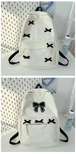 Detailed view of a white corduroy backpack with cute black bows and multi-pocket design