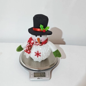 Detailed weight measurement showing 650g for the glowing plush Christmas snowman doll