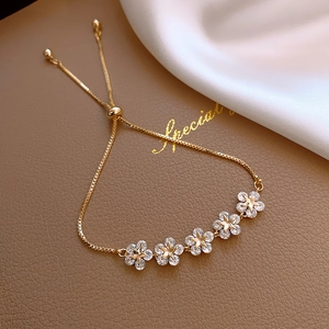 Gold-tone flower box chain bracelet with five zircon-inlaid plum blossom charms
