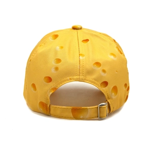 Detail of cheese print baseball cap featuring realistic texture and silver metal buckle
