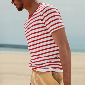 Detail of red and white striped men's cotton t-shirt fabric texture and round neckline