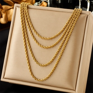 Layered gold twist rope chain necklace featuring four tiered strands in a punk hip-hop style