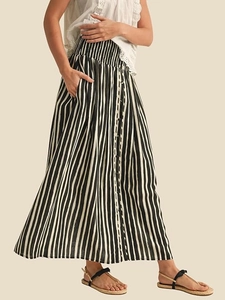 Elegant black and white striped high waist maxi skirt with buttons and side pockets