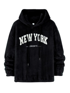 Detail view of New York Cheerful print and drawstring hood on black plush hoodie