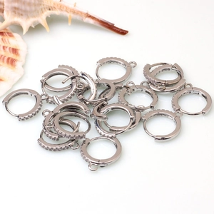 Macro shot of silver zircon-studded hinged earring hooks for DIY jewelry crafting
