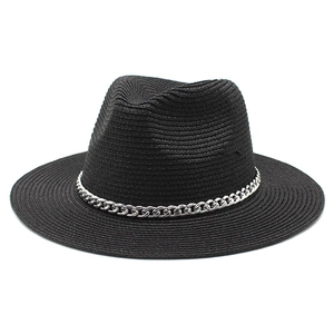 Close-up of black straw fedora hat featuring a stylish silver metal chain band detail