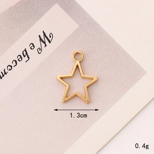 Close-up of golden hollow star pendant measuring 1.3cm and weighing 0.4g for jewelry DIY