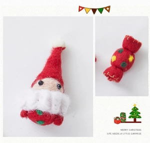 Detailed view of handmade wool felt Santa and colorful candy Christmas tree ornaments