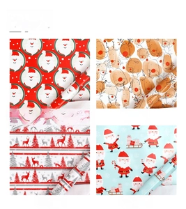 Close-up of four festive Christmas patterns featuring Santa Claus and reindeer on kraft paper