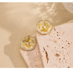Macro shot of gold brushed lotus leaf texture earrings in S925 sterling silver