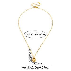 Detail showing gingerbread man pendant on gold O-chain with adjustable length specs