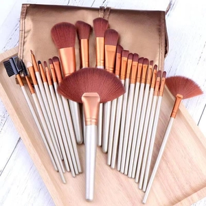 Professional 24pcs makeup brush set with rose gold handles and a stylish carry bag