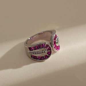 Close-up of double-layer silver ring with purple rectangle and clear round zircon stones