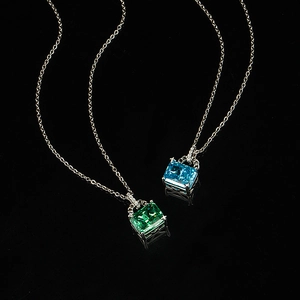 Elegant emerald and aquamarine square cut pendant necklaces on silver chains
