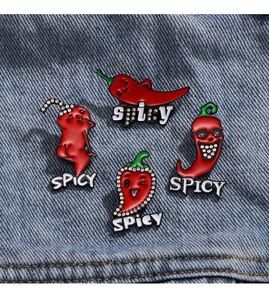 Set of funny red chili enamel pins with Spicy text and rhinestones on denim fabric