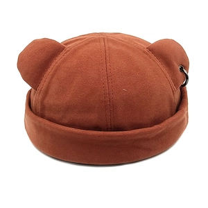 Detailed view of a cute terracotta miki hat with cat ears and metal ring accessory