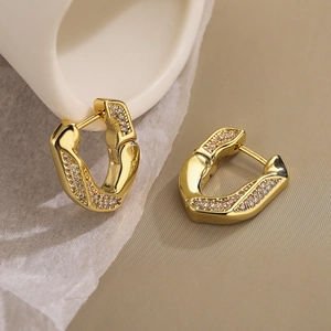 Fashionable gold plated geometric earrings with pavé zircons in a twisted U-shape