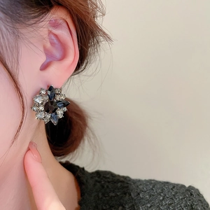 Vintage floral stud earrings with black and white rhinestones in a French court style
