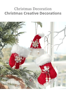 Detail of red knit Christmas stocking, hat, and glove ornaments with white fur trim