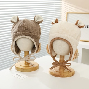Cute lion-style plush earflap hat for kids in brown and cream colors with pom-pom ties